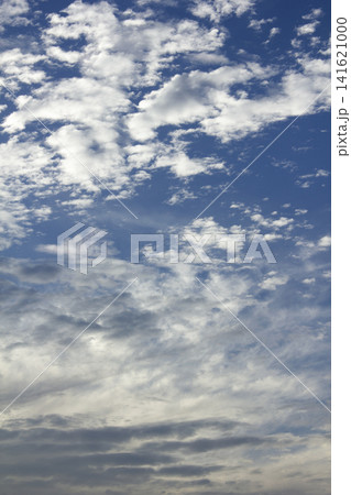 It is a blue sky with cirrocumulus clouds. 141621000