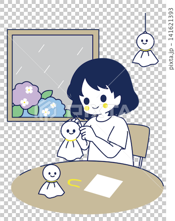 下雨天,一個女孩在製作晴天娃娃。 下雨天,一個女孩在製作晴天娃娃。 141621393