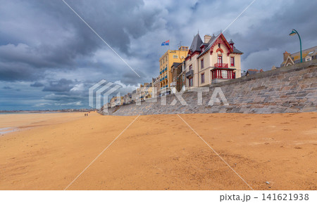 Sandy Beach and Historic Seawall in Saint Malo at Low Tide Brittany France Sandy Beach and Historic Seawall in Saint Malo at Low Tide Brittany France 141621938