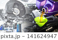 Pouring fresh motor oil into car engine with brake system maintenance background 141624947