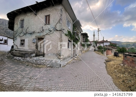Century old village house in Harmankoy, Bilecik, nestled in green nature with rustic textures and timeless rural charm. 141625799