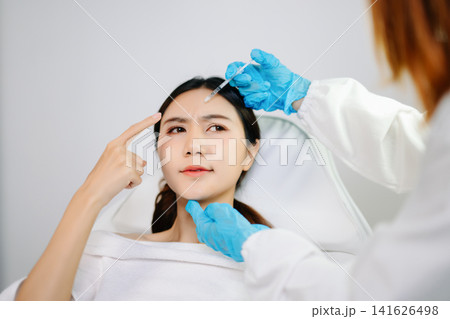 Professional beauty clinic treatment with facial injection, skincare, anti-aging and aesthetic care. Clean, sterile, modern healthcare concept Professional beauty clinic treatment with facial injection, skincare, anti-aging and aesthetic care. Clean, sterile, modern healthcare concept 141626498