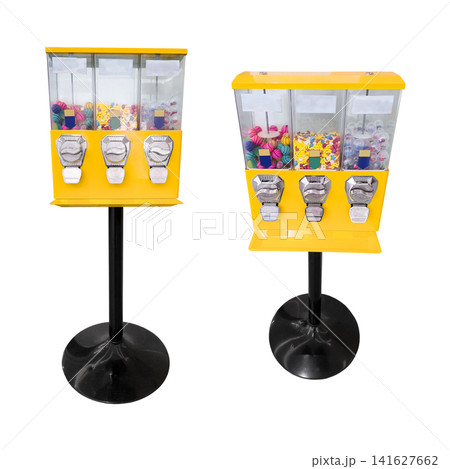 Set of yellow candy gumball vending machines standing on a stand isolated on white background 141627662