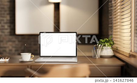 Modern Home Office Workspace with Laptop on Wooden Desk and Window Light Modern Home Office Workspace with Laptop on Wooden Desk and Window Light 141627846