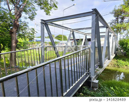 Pedestrian Steel Bridge Over a Canal Pedestrian Steel Bridge Over a Canal 141628489