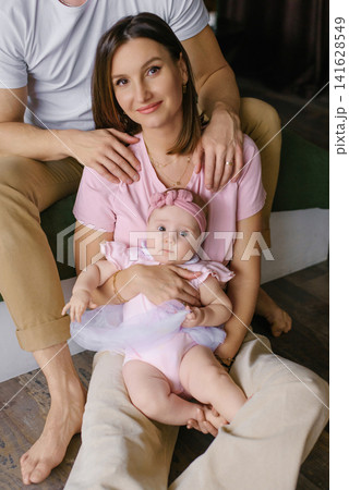 Mother With Baby Girl In Stylish Modern Bedroom Mother With Baby Girl In Stylish Modern Bedroom 141628549