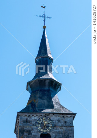 Historic Baroque Church Clock Tower of Saint Gangulphe Collegiate Church in Florennes Belgium Historic Baroque Church Clock Tower of Saint Gangulphe Collegiate Church in Florennes Belgium 141628727