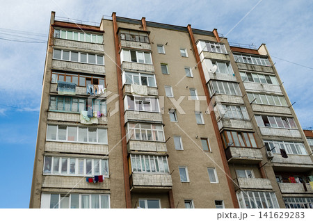 Residence encapsulates daily life under a vibrant sky with laundry swaying lightly in the urban breeze Residence encapsulates daily life under a vibrant sky with laundry swaying lightly in the urban breeze 141629283