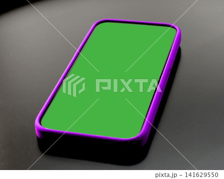 Blank green screen smartphone mockup tilted at an angle on a dark surface. Mobile phone display shows chroma key green ready for app insertion. Concept of green screen mockup, app Blank green screen smartphone mockup tilted at an angle on a dark surface. Mobile phone display shows chroma key green ready for app insertion. Concept of green screen mockup, app 141629550
