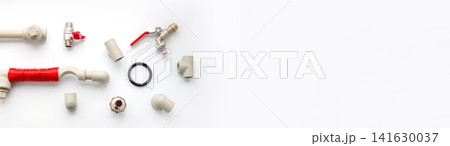 A flat lay composition of various plumbing supplies, including plastic pipes, fittings, valves, and connectors on a white background with empty copy space, illustrating plumbing, heating installation A flat lay composition of various plumbing supplies, including plastic pipes, fittings, valves, and connectors on a white background with empty copy space, illustrating plumbing, heating installation 141630037