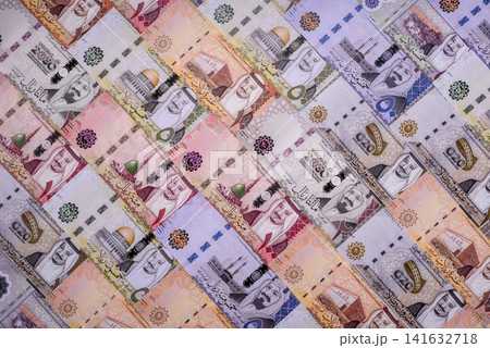 Saudi Arabia paper money, riyal banknotes and coins as currency for exchange. Saudi Arabia money Saudi Arabia paper money, riyal banknotes and coins as currency for exchange. Saudi Arabia money 141632718