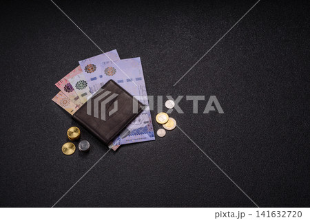 Saudi Arabia paper money, riyal banknotes and coins as currency for exchange. Saudi Arabia money Saudi Arabia paper money, riyal banknotes and coins as currency for exchange. Saudi Arabia money 141632720