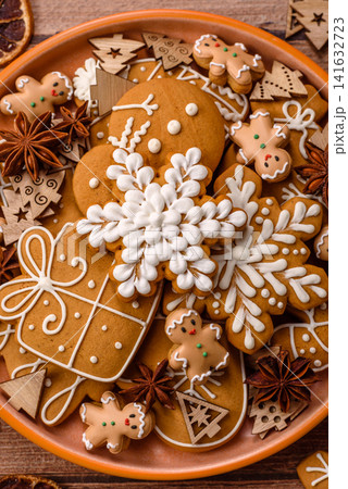 Gingerbread as a Christmas staple, sweet biscuits for the holiday table. Gingerbread as a backdrop Gingerbread as a Christmas staple, sweet biscuits for the holiday table. Gingerbread as a backdrop 141632723