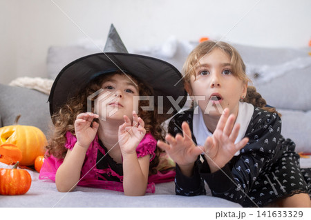 Girls in Halloween costumes 141633329