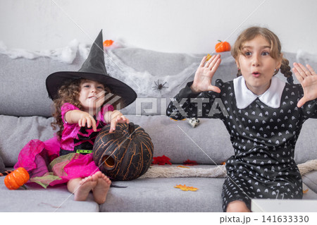 Girls in Halloween costumes 141633330