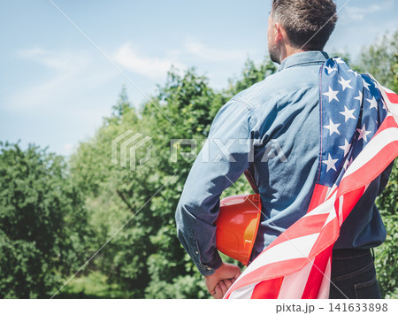 Construction worker and American flag Construction worker and American flag 141633898