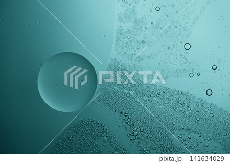 Abstract background of oil droplets and bubbles suspended in teal liquid Abstract background of oil droplets and bubbles suspended in teal liquid 141634029