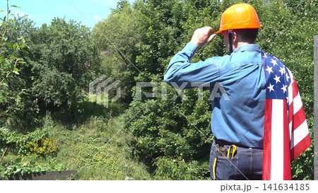 Construction worker and American flag Construction worker and American flag 141634185