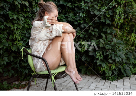 Mature woman with vitiligo skin and gray hair.  Female with autoimmune disease. pigmentation.  scene radiates tranquility, self love, and body positivity, capturing the essence of embracing  141635034