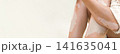Close up of female legs and arms with vitiligo, unique pigmentation, autoimmune skin condition, copy space 141635041
