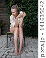 Mature woman with vitiligo skin and gray hair.  Female with autoimmune disease. pigmentation.  scene radiates tranquility, self love, and body positivity, capturing the essence of embracing  141635042