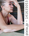 Mature woman with vitiligo skin and gray hair.  Female with autoimmune disease. pigmentation.  scene radiates tranquility, self love, and body positivity, capturing the essence of embracing  141635053