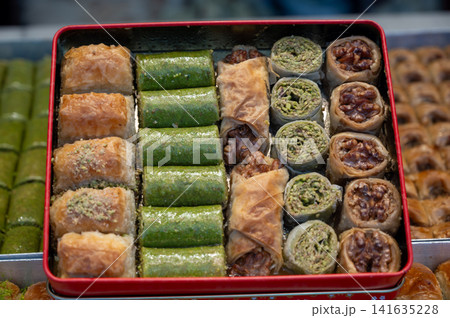 Istanbul, turkey. August 2, 2025. Baklava pieces with pistachio and walnut fillings, offering traditional sweets from istanbul Istanbul, turkey. August 2, 2025. Baklava pieces with pistachio and walnut fillings, offering traditional sweets from istanbul 141635228