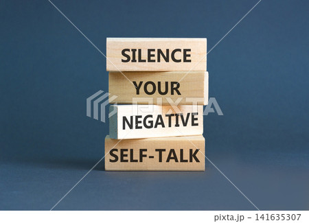 Silence your negative self-talk symbol. Concept words Silence your negative self-talk on beautiful wooden blocks. Beautiful grey background. Psychological negative self-talk concept. Copy space. Silence your negative self-talk symbol. Concept words Silence your negative self-talk on beautiful wooden blocks. Beautiful grey background. Psychological negative self-talk concept. Copy space. 141635307