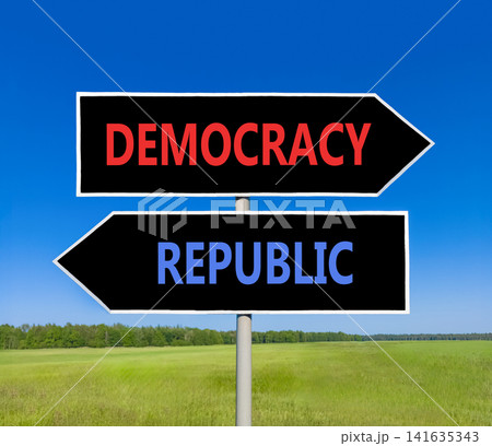 Democracy or republic words symbol. Concept words Democracy Republic on beautiful black road sign. Beautiful blue sky background. Business democracy republic concept. Copy space Democracy or republic words symbol. Concept words Democracy Republic on beautiful black road sign. Beautiful blue sky background. Business democracy republic concept. Copy space 141635343