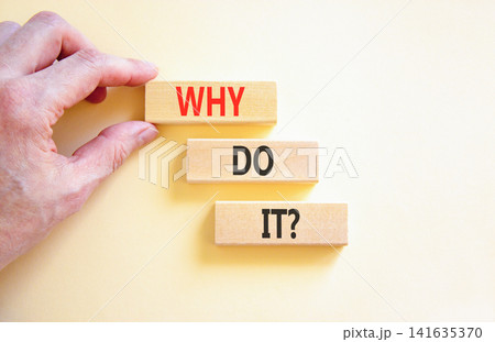 Why do it words symbol. Concept words Why do it on beautiful wooden blocks. Beautiful white background. Businessman hand. Business support motivational and Why do it concept. Copy space. Why do it words symbol. Concept words Why do it on beautiful wooden blocks. Beautiful white background. Businessman hand. Business support motivational and Why do it concept. Copy space. 141635370