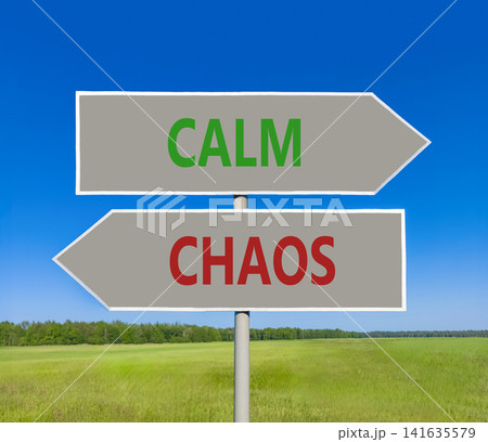 Calm instead chaos words symbol. Concept words Calm Chaos on beautiful grey road sign. Beautiful blue sky background. Business medical psychology calm chaos concept. Copy space. Calm instead chaos words symbol. Concept words Calm Chaos on beautiful grey road sign. Beautiful blue sky background. Business medical psychology calm chaos concept. Copy space. 141635579