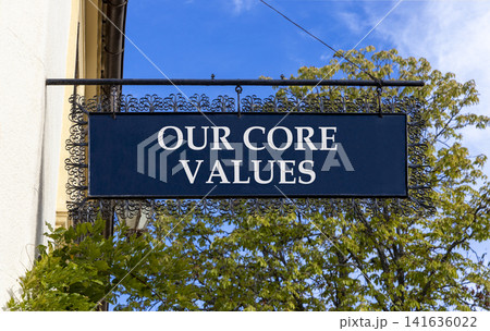 Our core values words symbol. Concept words Our core values on beautiful black road sign. Beautiful blue sky green tree background. Business our core values motivational support concept. Copy space. Our core values words symbol. Concept words Our core values on beautiful black road sign. Beautiful blue sky green tree background. Business our core values motivational support concept. Copy space. 141636022