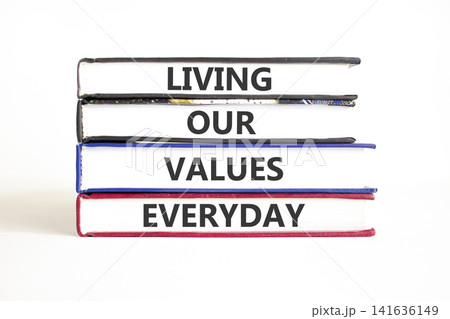 Living our values everyday words symbol. Concept words Living our values everyday on beautiful books. Beautiful white background. Business living our values everyday concept. Copy space. Living our values everyday words symbol. Concept words Living our values everyday on beautiful books. Beautiful white background. Business living our values everyday concept. Copy space. 141636149