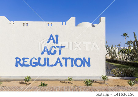 AI act regulation words symbol. Concept words AI artificial intelligence act regulation on beautiful white wall. Beautiful blue sky background. Business AI act regulation concept. Copy space. 141636156