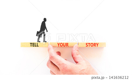 Tell your story symbol. Concept word Tell your story on beautiful wooden blocks. Beautiful white table white background. Businessman hand. Business tell your story concept. Copy space. Tell your story symbol. Concept word Tell your story on beautiful wooden blocks. Beautiful white table white background. Businessman hand. Business tell your story concept. Copy space. 141636212