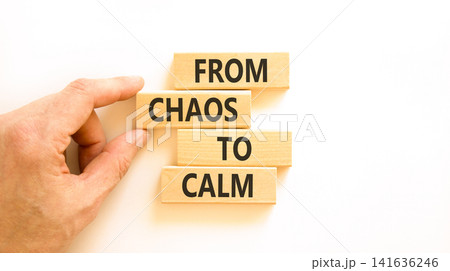From chaos to calm symbol. Concept words From chaos to calm on beautiful wooden blocks. Beautiful white background. Businessman hand. Business psychological from chaos to calm concept. Copy space. From chaos to calm symbol. Concept words From chaos to calm on beautiful wooden blocks. Beautiful white background. Businessman hand. Business psychological from chaos to calm concept. Copy space. 141636246