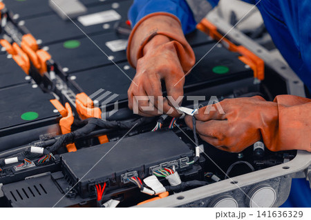 Professional EV Car Service, Male worker Electricity Vehicle Fix Maintenance EV Car Battery Professional EV Car Service, Male worker Electricity Vehicle Fix Maintenance EV Car Battery 141636329