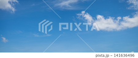 Beautiful blue sky and white cumulus clouds abstract background. Cloudscape background. Blue sky and fluffy white clouds on sunny days. Blue sky and daylight. World Ozone Day. Ozone layer. Summer sky. Beautiful blue sky and white cumulus clouds abstract background. Cloudscape background. Blue sky and fluffy white clouds on sunny days. Blue sky and daylight. World Ozone Day. Ozone layer. Summer sky. 141636496