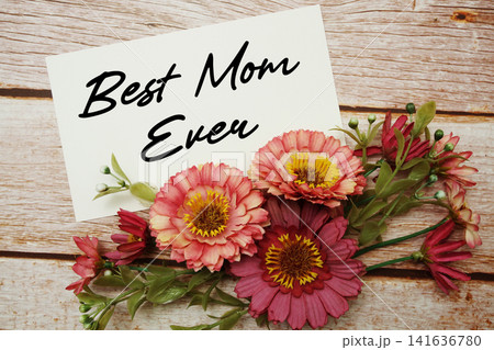Best Mom Ever text written on paper card with flowers decorations Best Mom Ever text written on paper card with flowers decorations 141636780