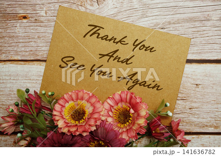 Thank You And See You Again text written on paper card with flowers decorations Thank You And See You Again text written on paper card with flowers decorations 141636782