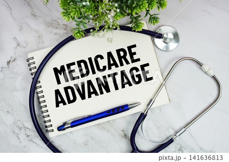 Medicare Advantage text written on notepad with stethoscope on marble background Medicare Advantage text written on notepad with stethoscope on marble background 141636813