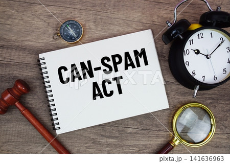 CAN-SPAM Act message written on notepad with alarm clock, wood gavel and magnifying glass flat lay on wooden background CAN-SPAM Act message written on notepad with alarm clock, wood gavel and magnifying glass flat lay on wooden background 141636963