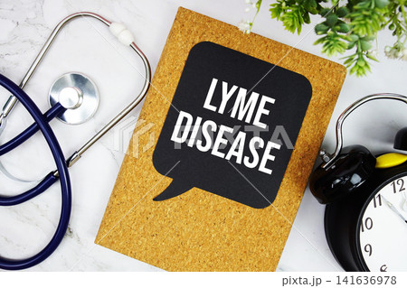 Lyme Disease text with stethoscope and alarm clock on marble background Lyme Disease text with stethoscope and alarm clock on marble background 141636978