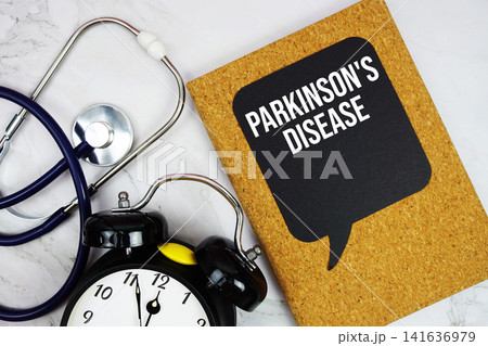 Parkinson's Disease text with stethoscope and alarm clock on marble background Parkinson's Disease text with stethoscope and alarm clock on marble background 141636979