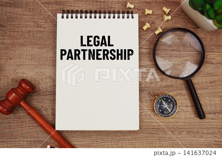 Fair Labor Standards Act message written on notepad with wood gavel and magnifying glass flat lay on wooden background Fair Labor Standards Act message written on notepad with wood gavel and magnifying glass flat lay on wooden background 141637024