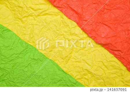 three color crumpled paper green yellow red diagonal stripes background texture 141637091