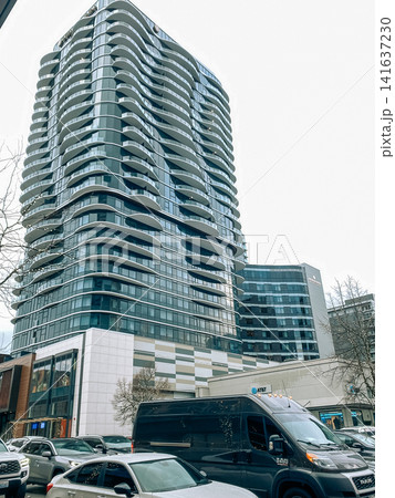Modern high-rise residential building with distinctive wavy balconies in an urban city center - 11.04.2024, Bellevue WA, USA 141637230