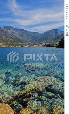 Scenic view of clear turquoise sea water bay in Bali village surrounded by majestic mountains in Crete Greece for summer resort vacation travel stock background Scenic view of clear turquoise sea water bay in Bali village surrounded by majestic mountains in Crete Greece for summer resort vacation travel stock background 141637431