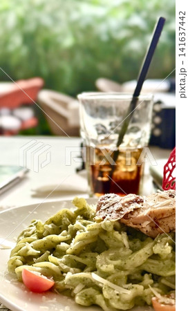Pasta Pesto with Grilled Chicken and Cherry Tomatoes 141637442