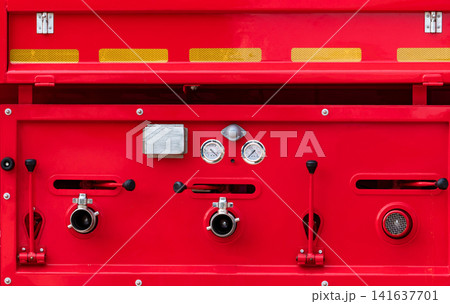 Firefighting pump control panel on modern fire truck with pressure gauges, hose connections and emergency equipment for fire protection and rescue operations. Firefighting technology and public safety Firefighting pump control panel on modern fire truck with pressure gauges, hose connections and emergency equipment for fire protection and rescue operations. Firefighting technology and public safety 141637701